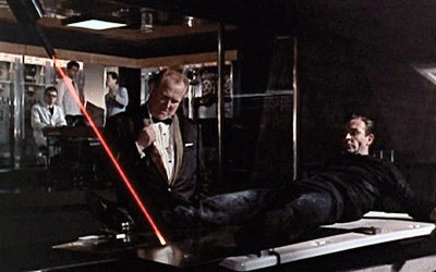 James Bond in Goldfinger (1964), as played by Sean Connery - in a precarious situation involving a laser